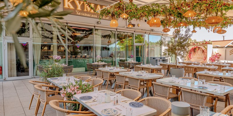 Kymata Modern - Willkommen im Kymata Modern in München-Nymphenburg – griechisch-mediterranes Flair für Ihre Gäste.